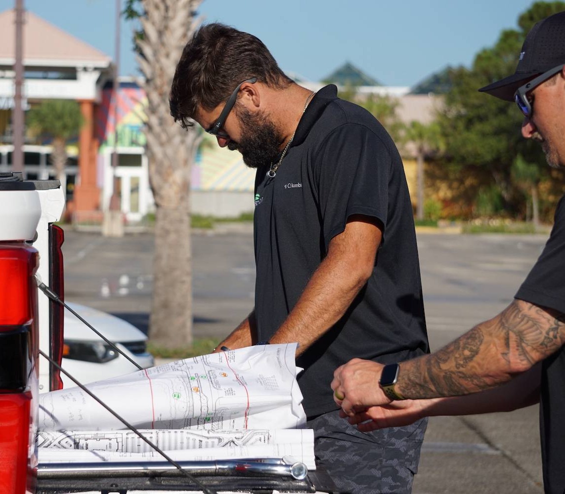 Landscape company maintaining shopping plaza in Delray Beach, FL