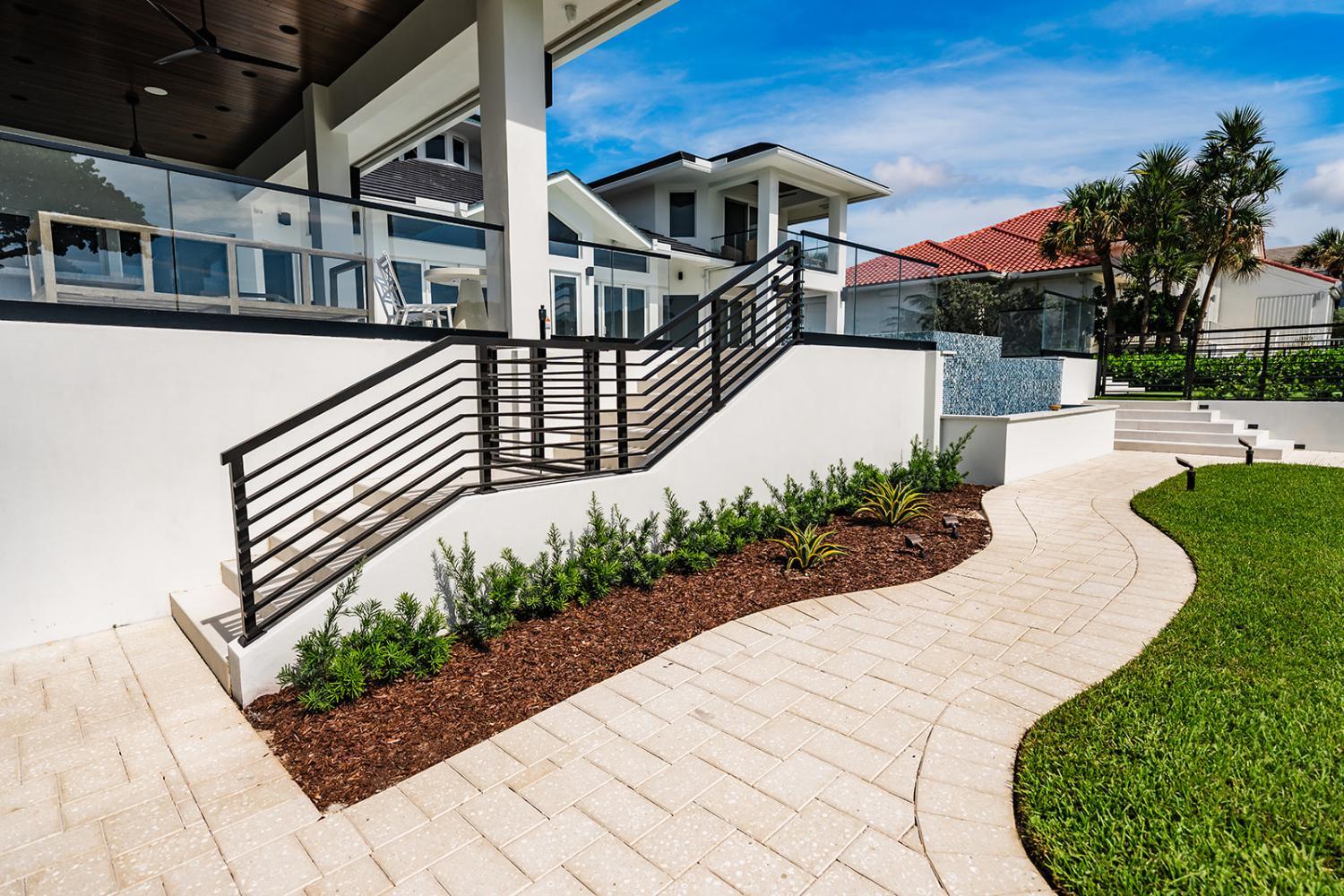 Landscape enhancements with fresh mulch and plantings at HOA in Boynton Beach, FL