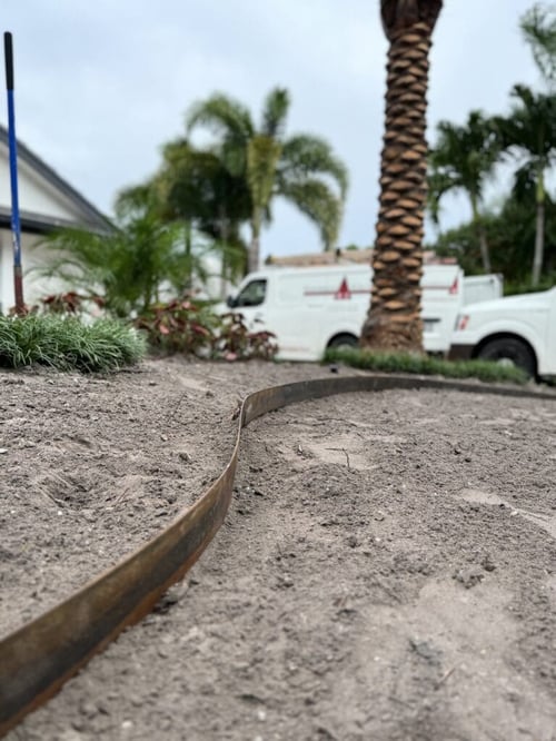 Landscape services with metal edging installation and bed preparation in Manalapan, FL