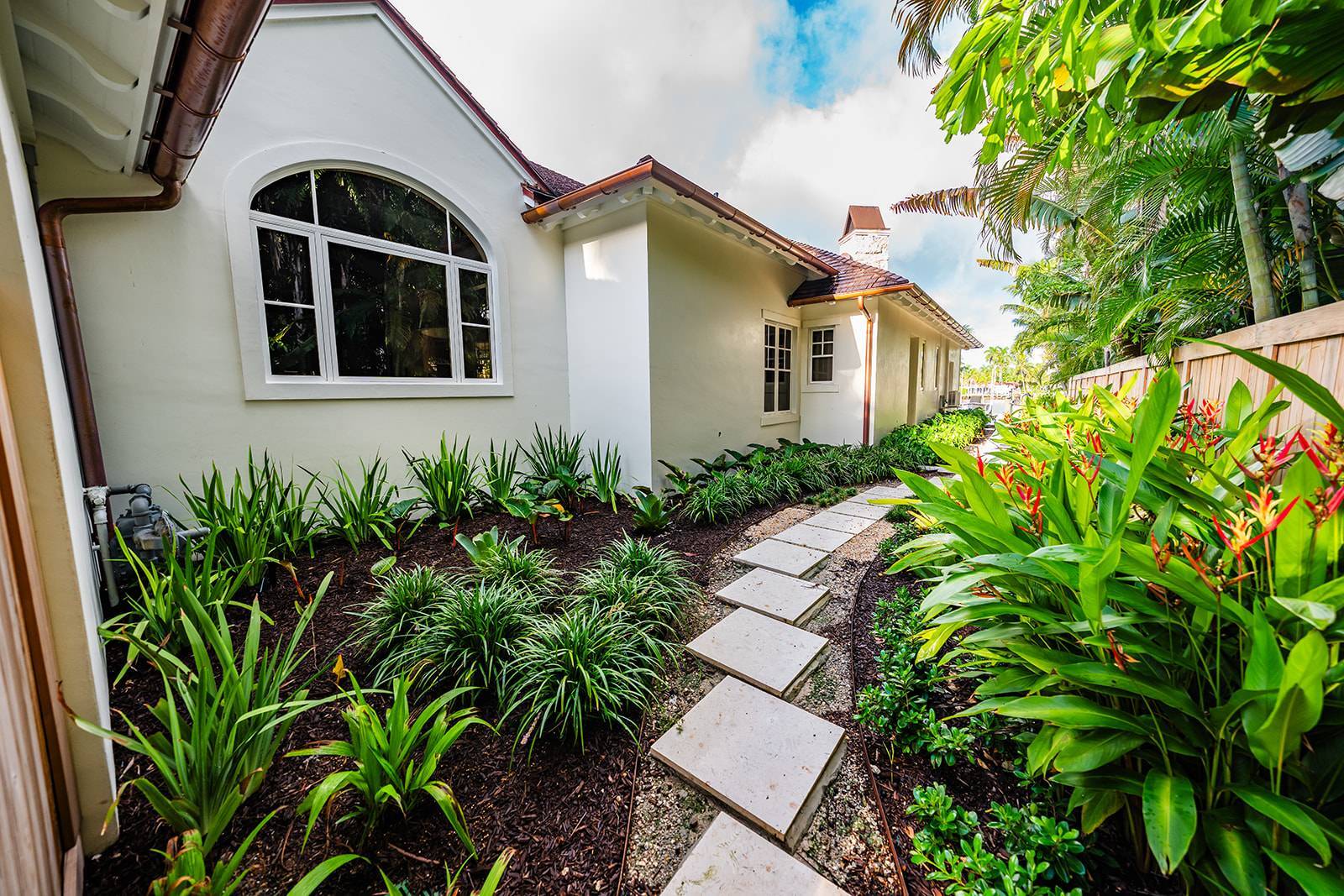 Limestone pool edge with integrated planter and drainage solutions in West Palm Beach, FL
