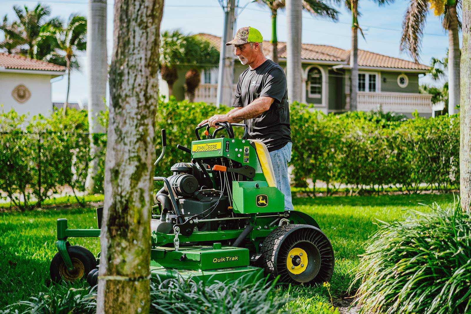 Commercial landscape maintenance crews servicing an HOA property in Boynton Beach, FL