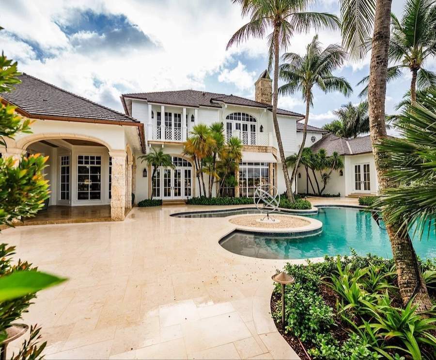 Custom pool and spa with landscape enhancements along waterfront property in Boynton Beach, FL-1