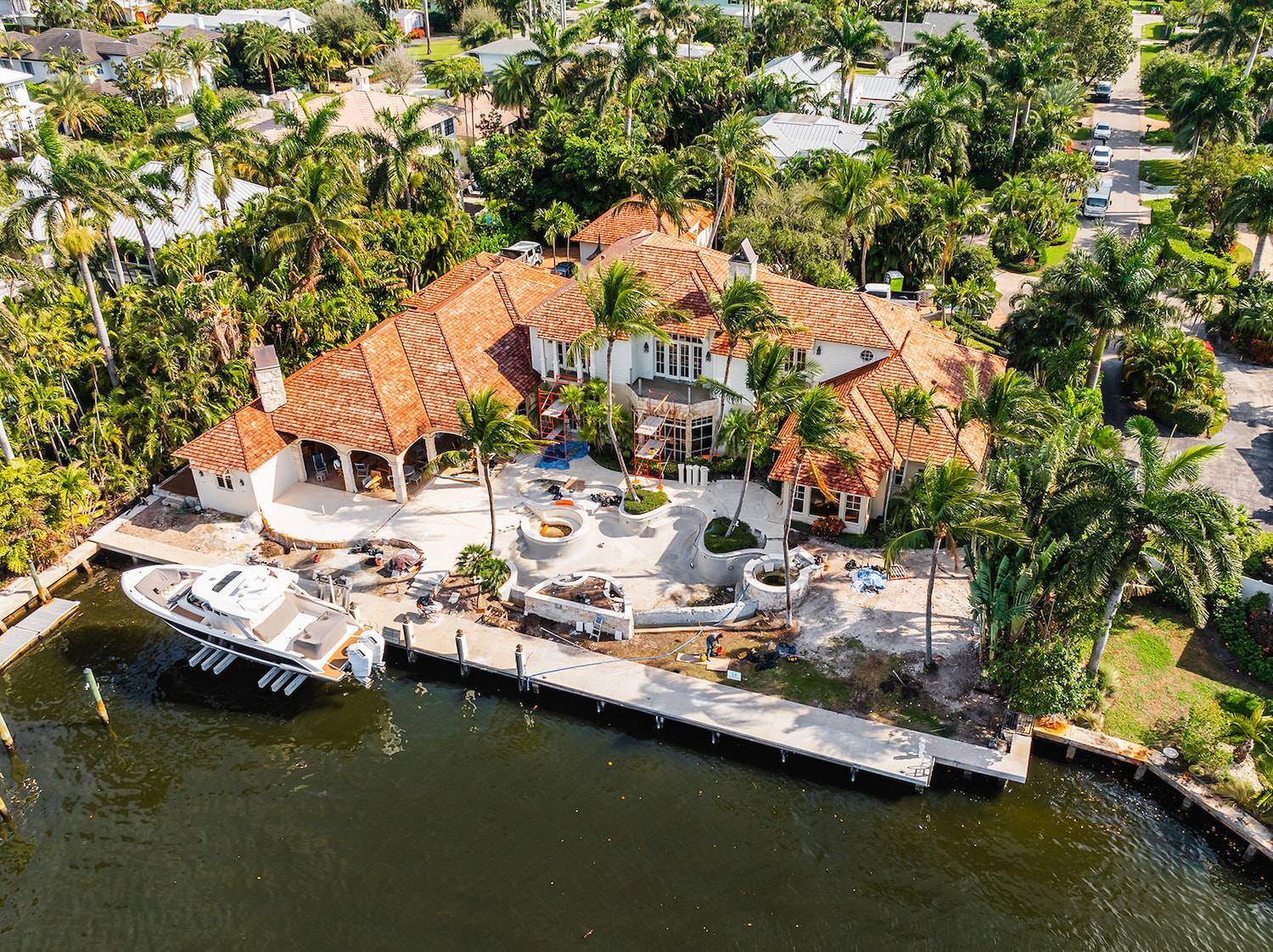 Estate renovation in progress with landscape construction and pool installation in Palm Beach, FL-1