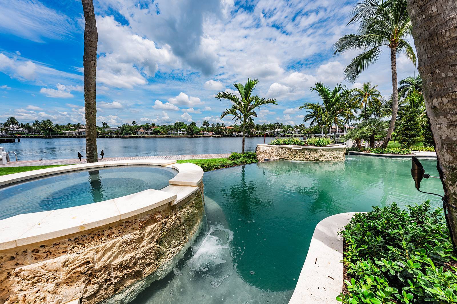 High-end residential landscape design with waterfront views in Palm Beach, FL