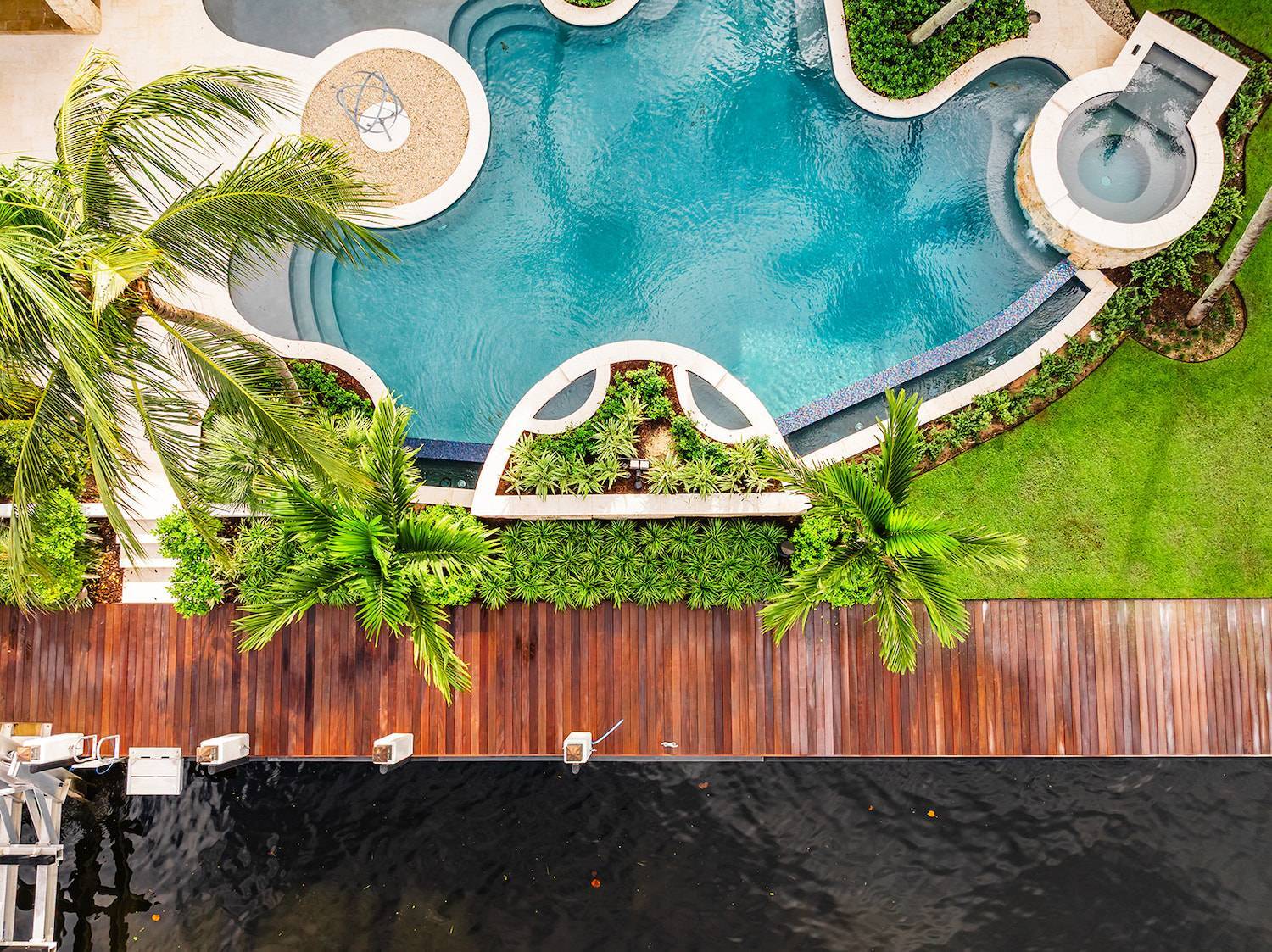 Tropical estate landscape with irrigation system and drainage solutions in Wellington, FL
