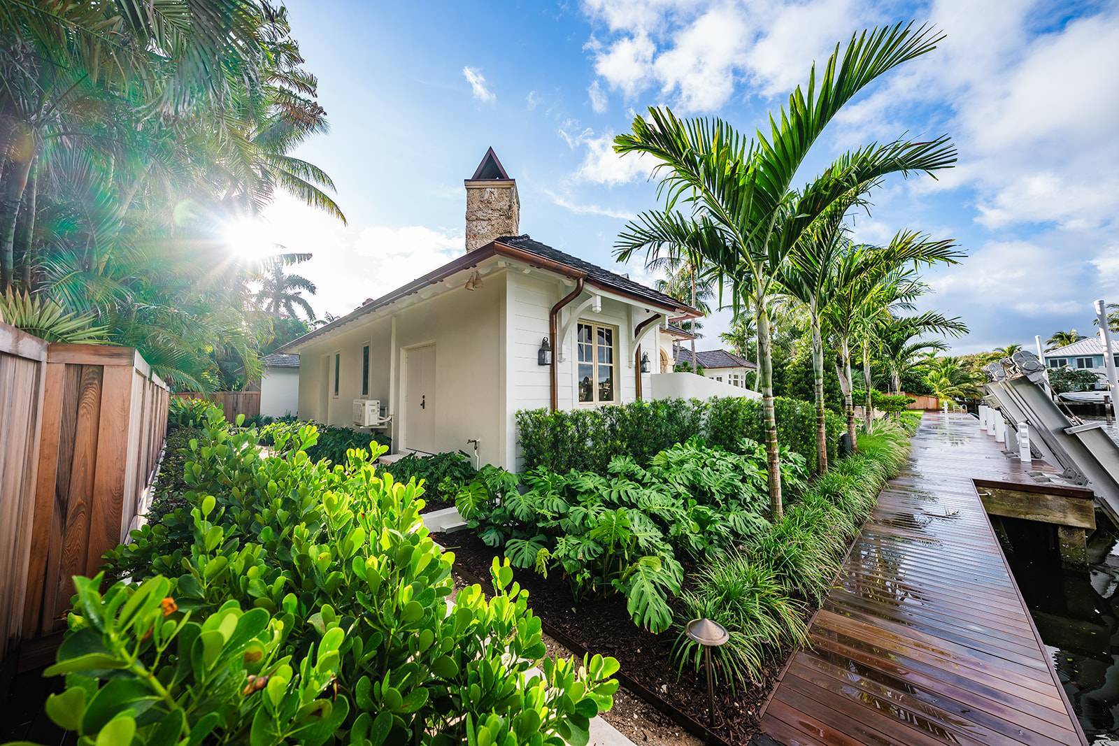 Waterfront property with professional landscape services and tropical design in Boca Raton, FL